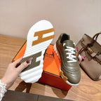 Hermes unisex luxury shoe outsole view with white tread and tan grip pattern