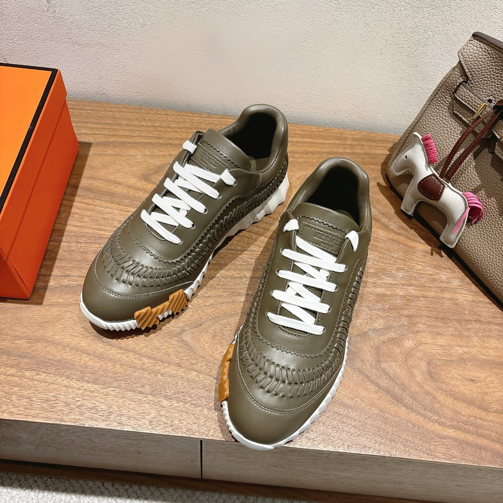 Hermes unisex luxury sneakers in olive green with white laces and chunky sole
