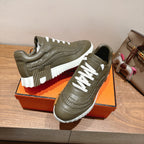 Hermes unisex luxury sneakers in olive green with white laces and thick white ridged sole