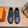 Hermes unisex sneakers in dark blue leather with lace-up front and textured sole