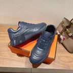 Hermes unisex dark blue lace-up sneakers with embossed straps and thick tread sole