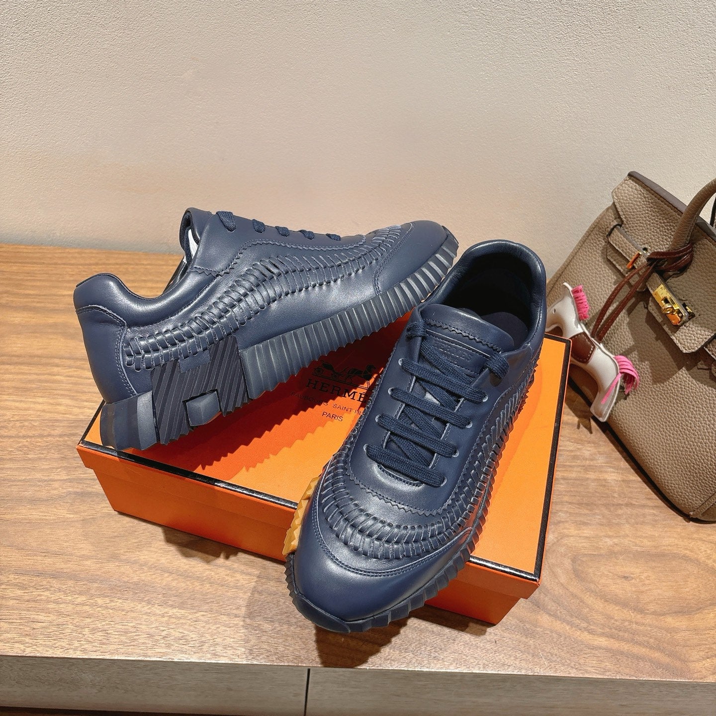 Hermes unisex dark blue lace-up sneakers with embossed straps and thick tread sole
