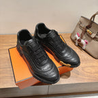 Pair of black lace-up sneakers with sculpted tread sole, Hermes unisex