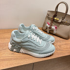 Hermes unisex light blue sneakers with white laces and textured toe and sides