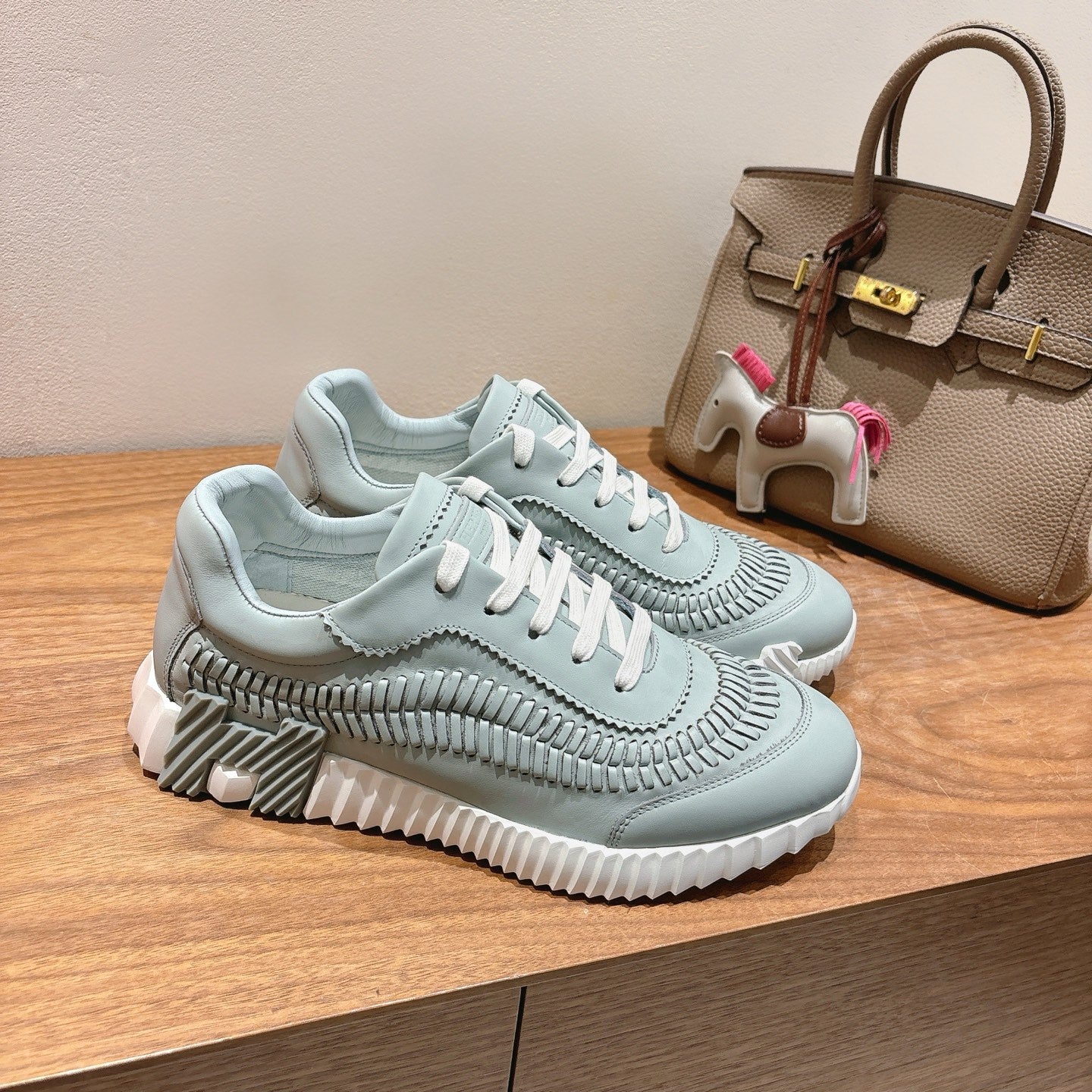 Hermes unisex light blue sneakers with white laces and textured toe and sides