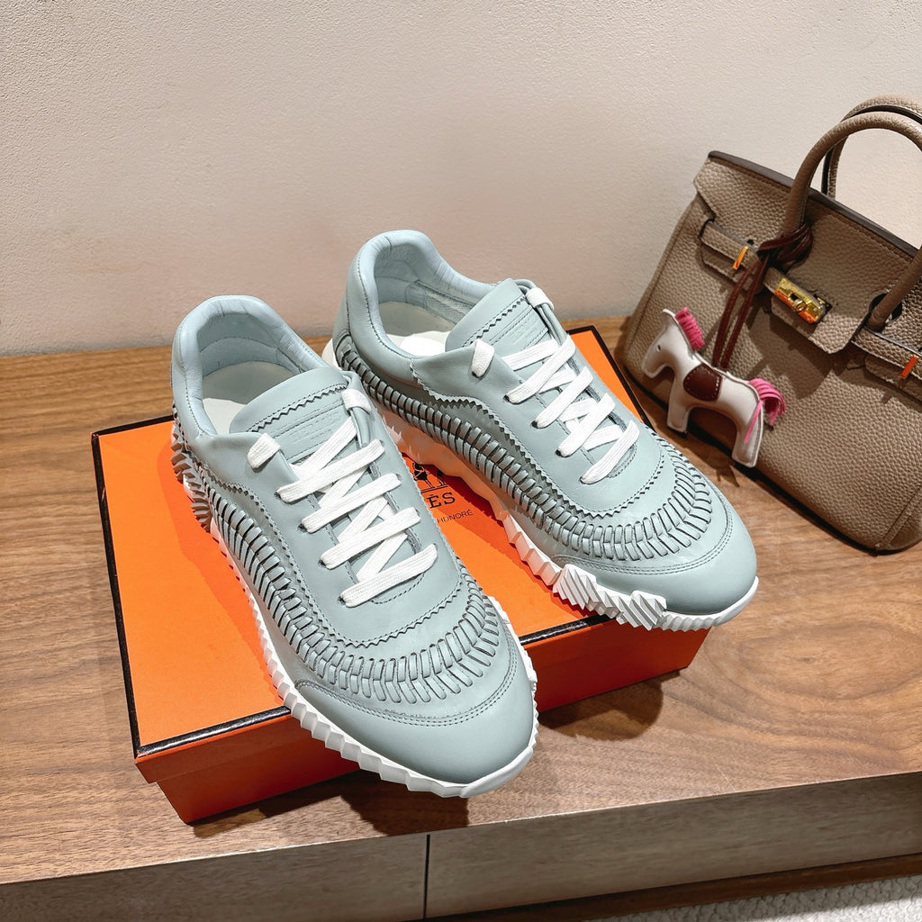 Hermes unisex light blue sneakers with white laces and chunky white tread sole