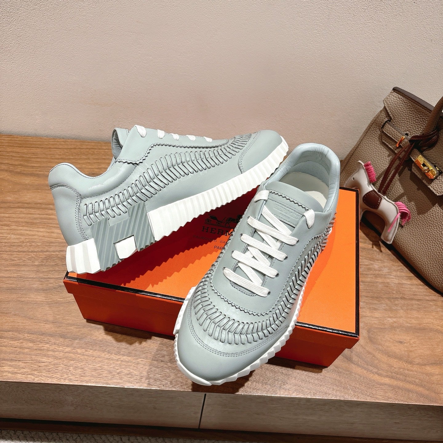 Hermes unisex light blue sneakers with white laces and ridged midsole