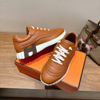 Hermes unisex leather sneakers, tan upper with white laces and thick white tread sole