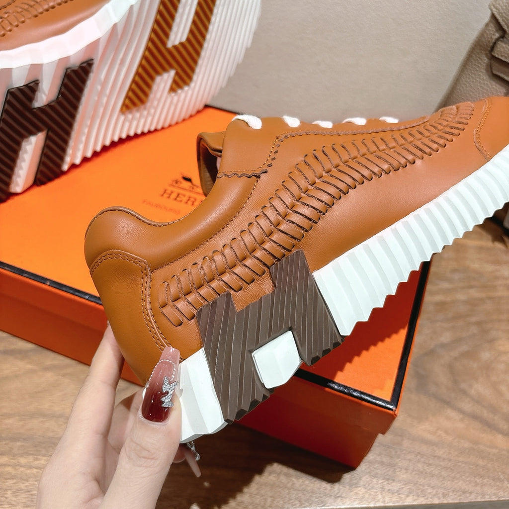 Hermes unisex leather sneaker, tan with braided side detail and white ribbed sole