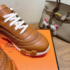 Hermes unisex leather sneaker, tan with white laces and textured braid-like panel detail