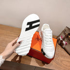 Hermes unisex white sneaker outsole, thick tread with black logo mark