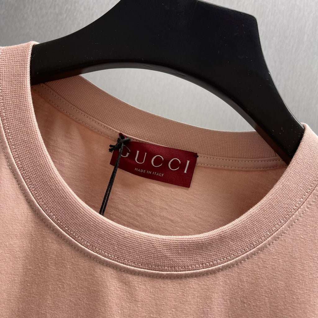 Light pink crewneck T-shirt with Gucci neck label and inner tag