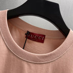 Light pink crewneck T-shirt with Gucci neck label and inner tag