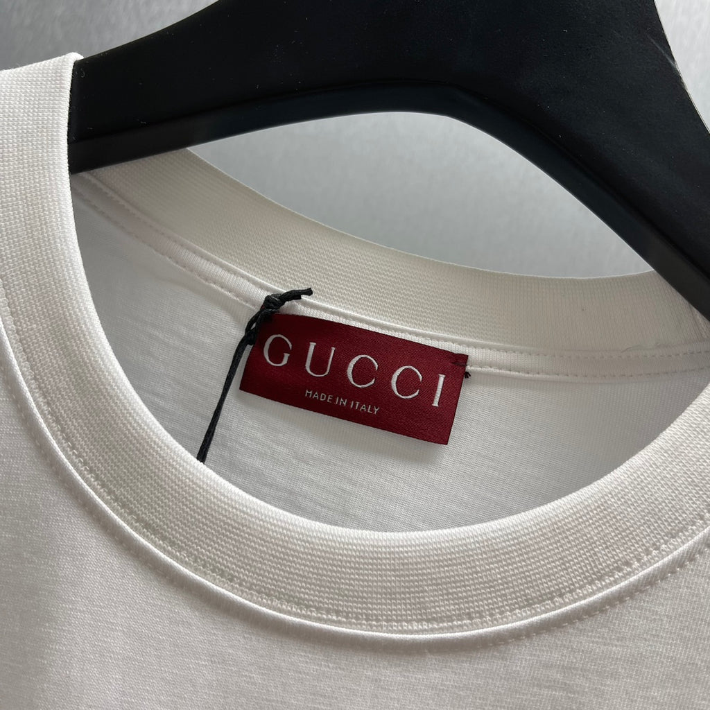 White crew-neck T-shirt label at neckline with Gucci Made in Italy tag