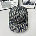 Geometric monogram baseball cap in navy and beige, with adjustable back strap