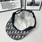 Baseball cap interior with striped lining and care label, adjustable strap