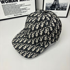 Dior baseball cap side view with navy-and-cream Dior monogram pattern, curved brim