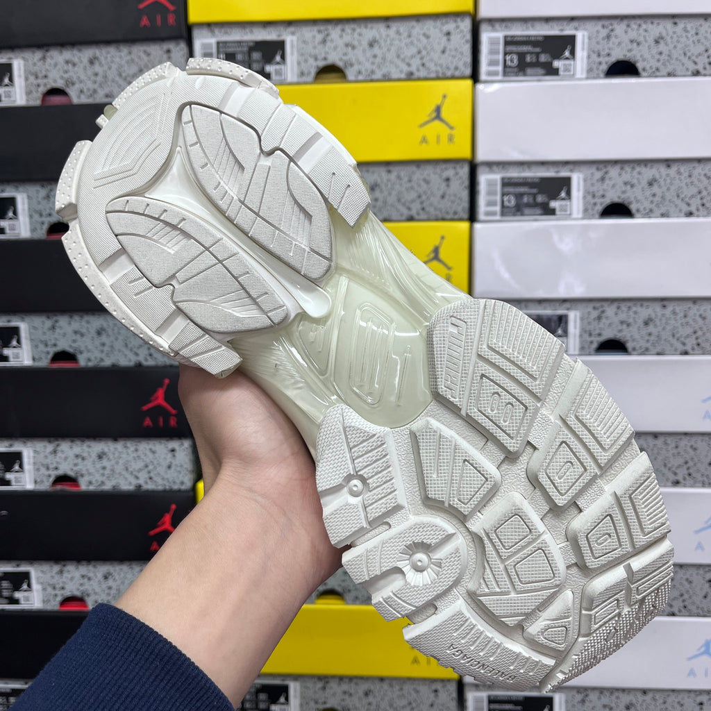Balenciaga white Runner sneakers, outsole view with deep tread and cushioned sidewall