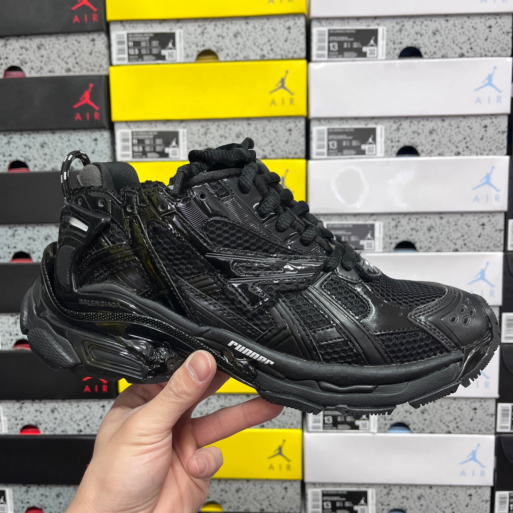 Balenciaga unisex black running sneaker with lace-up front and sculpted side sole