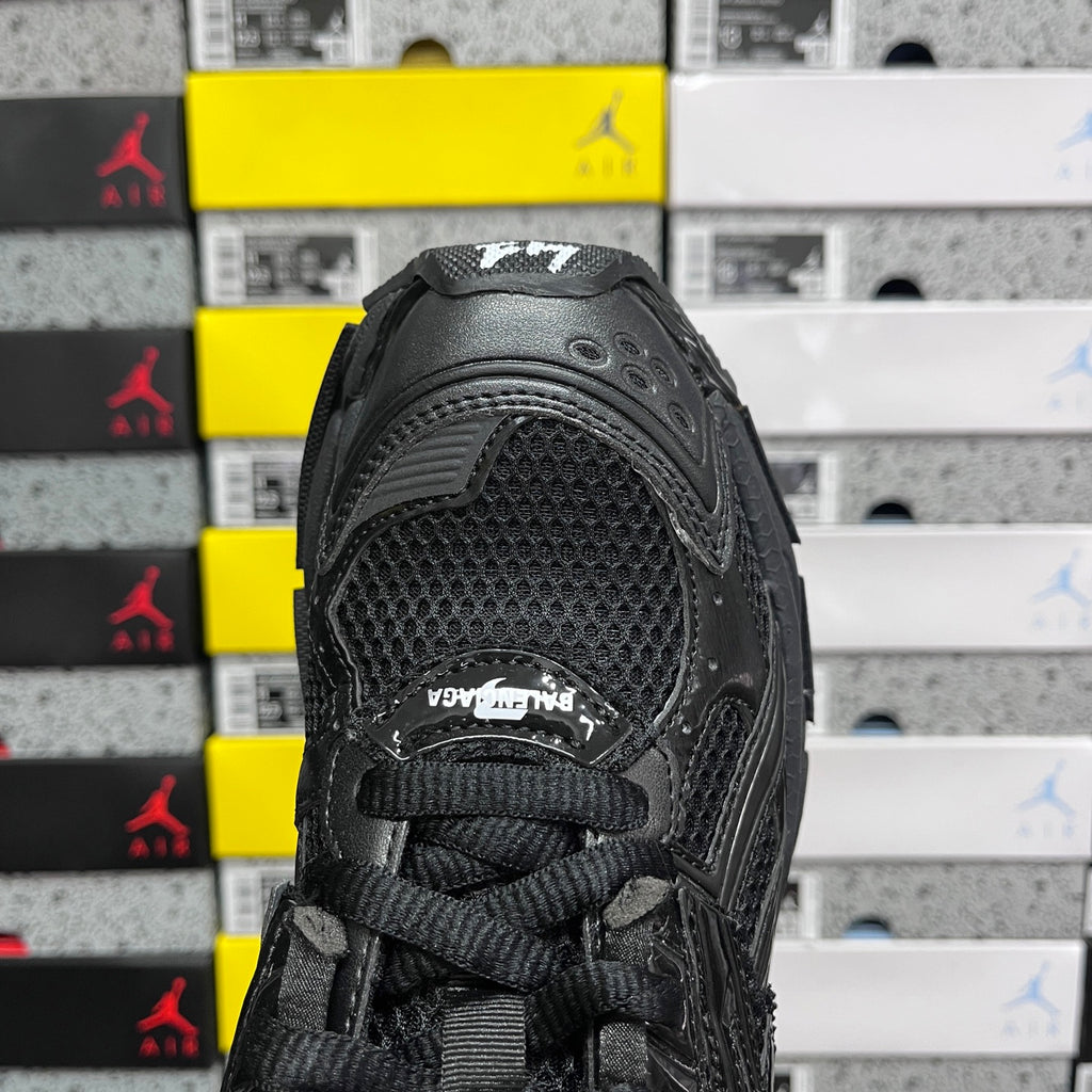 Balenciaga unisex black sneaker toe area with mesh panels and lace opening