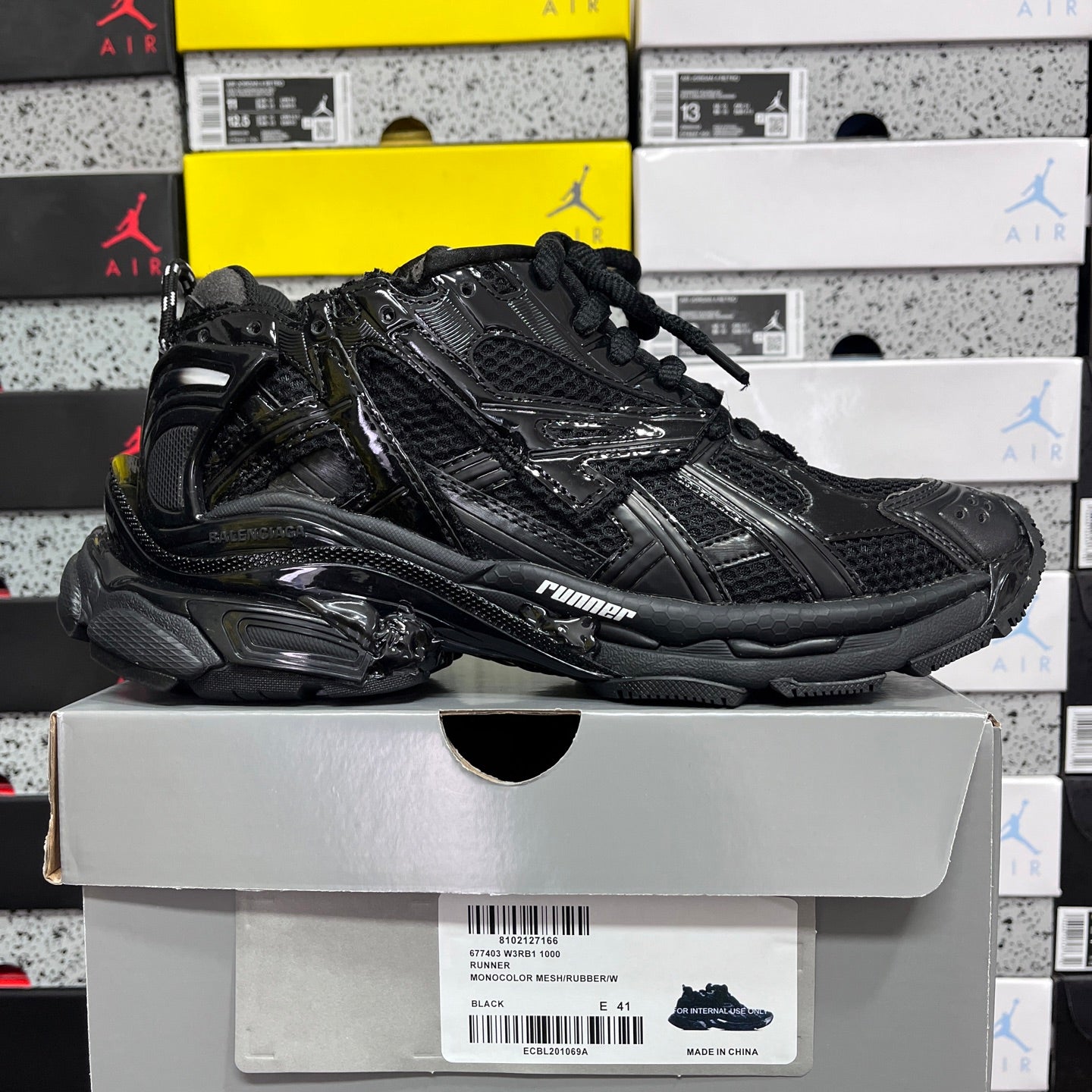 Balenciaga unisex black running sneaker with lace-up and chunky midsole