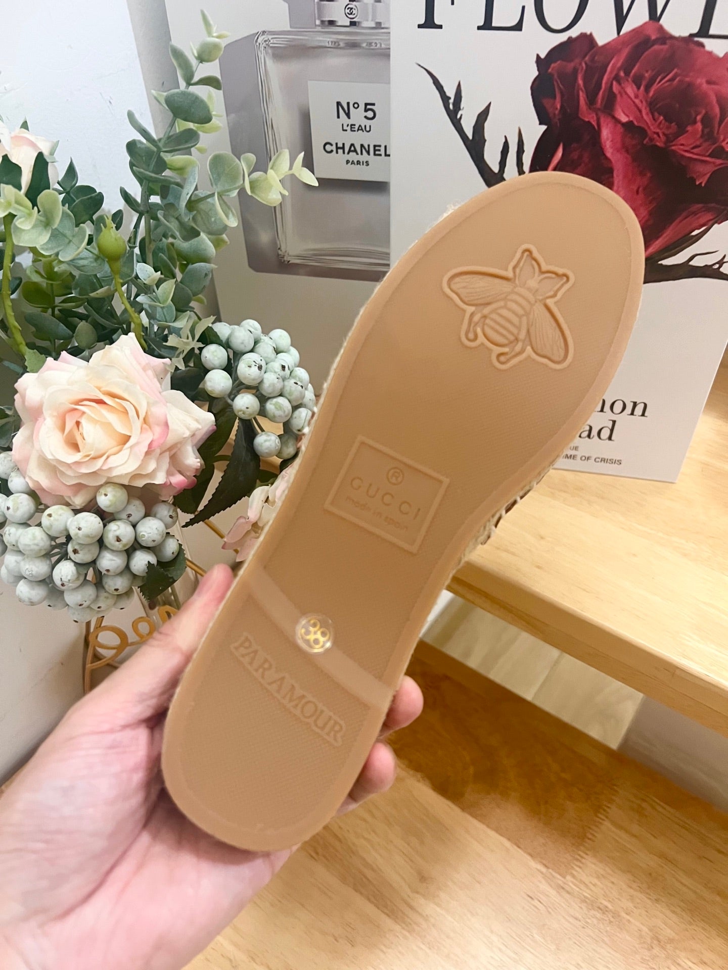 Sandal outsole in light tan with embossed logo and traction pattern