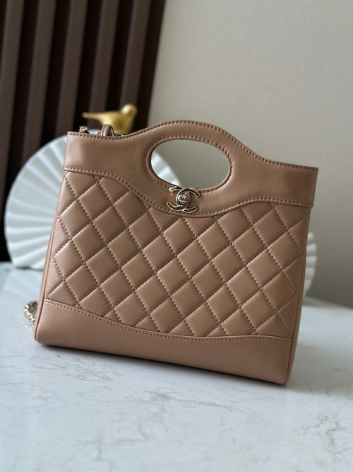 Chanel quilted beige leather handbag with oval cutout handle and chain strap