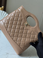 Chanel quilted beige leather panel with oval cutout and signature clasp hardware
