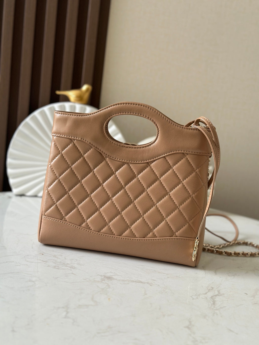 Chanel quilted beige leather handbag with oval cutout handle and top strap