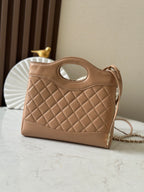 Chanel quilted beige leather handbag with oval cutout handle and top strap