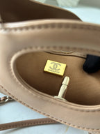 Chanel handbag interior close-up showing fabric lining and size tag