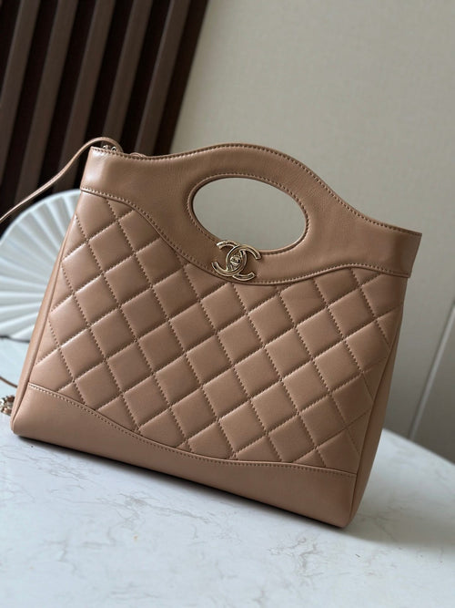 Chanel quilted leather tote bag with oval cutout and CC logo, top handle