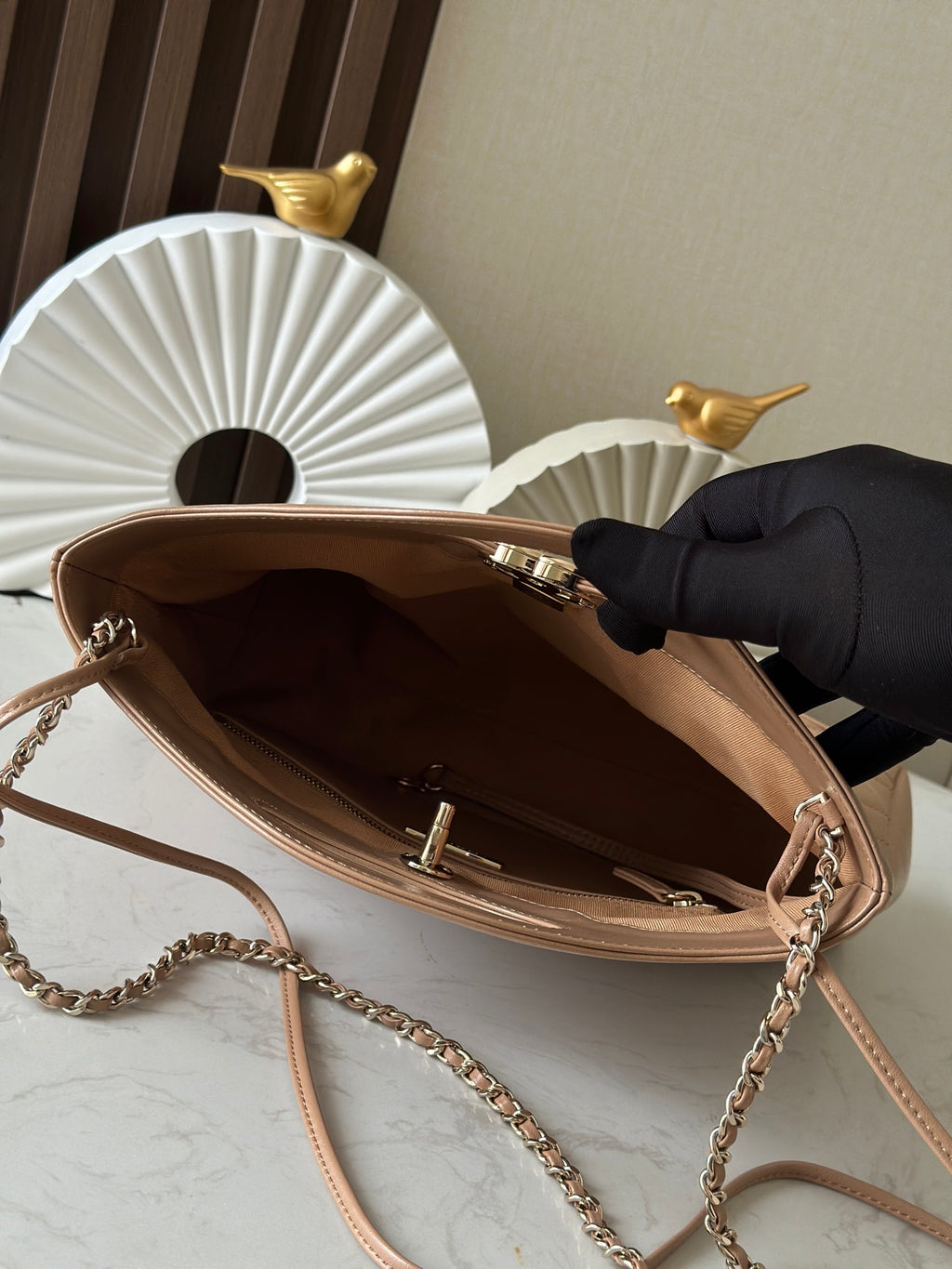 Chanel quilted leather handbag opened interior, chain strap and top hardware