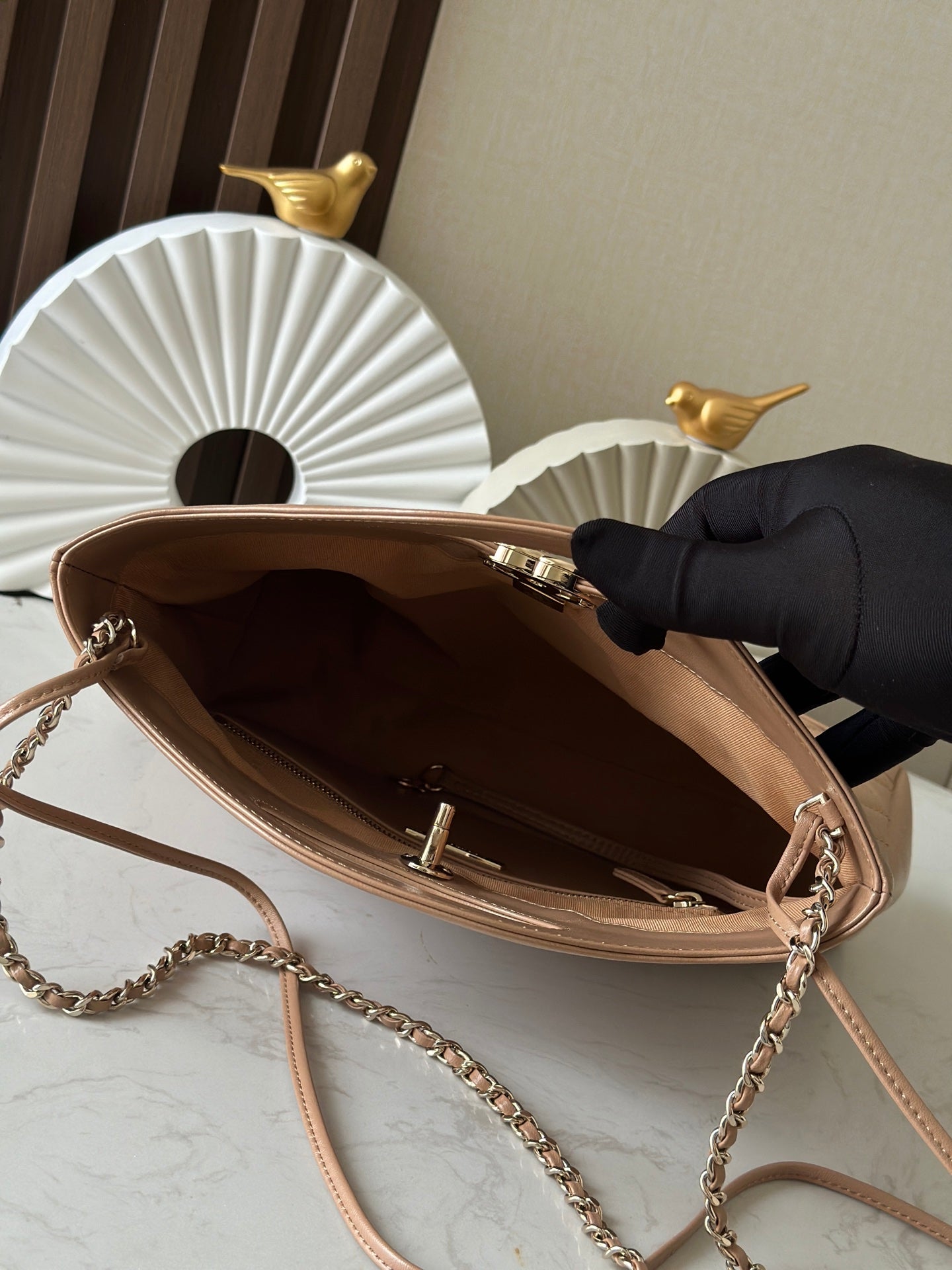 Chanel quilted leather handbag opened interior, chain strap and top hardware