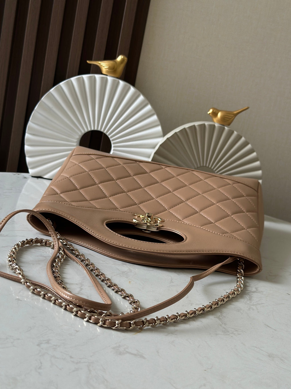 Chanel quilted shoulder bag with chain strap, flap top, oval cutout and CC logo