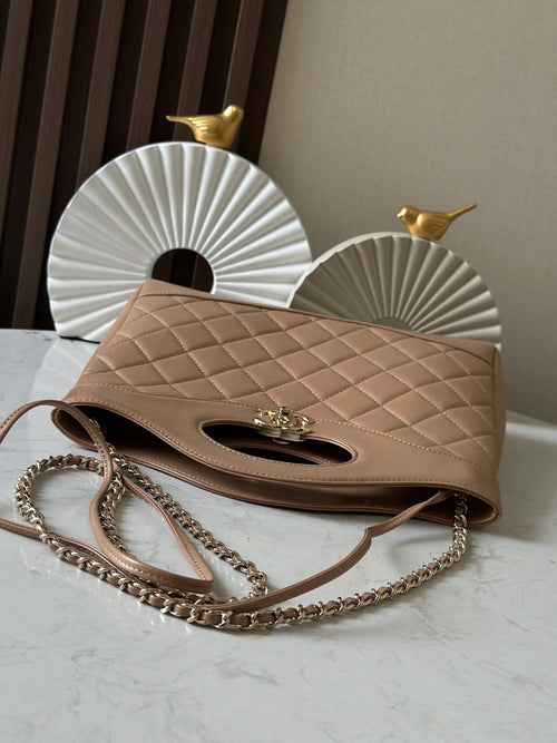 Chanel quilted shoulder bag with chain strap, flap top, oval cutout and CC logo