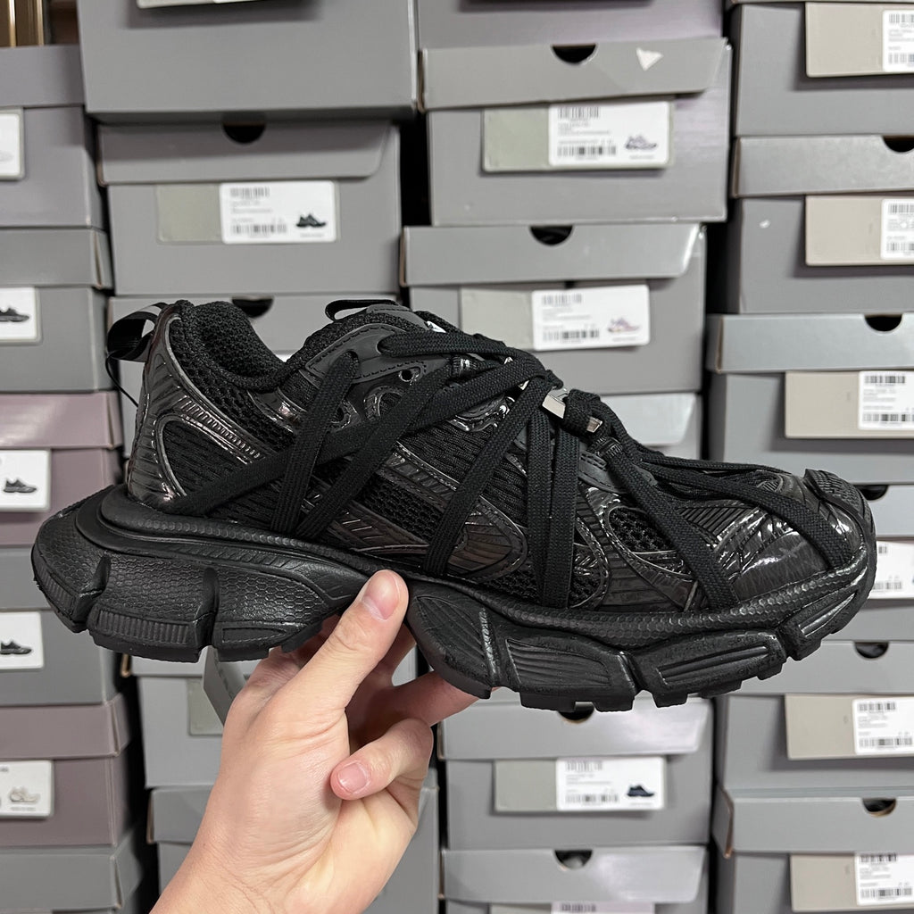 Black Balenciaga unisex sneakers, side angle with lace-up front and chunky midsole