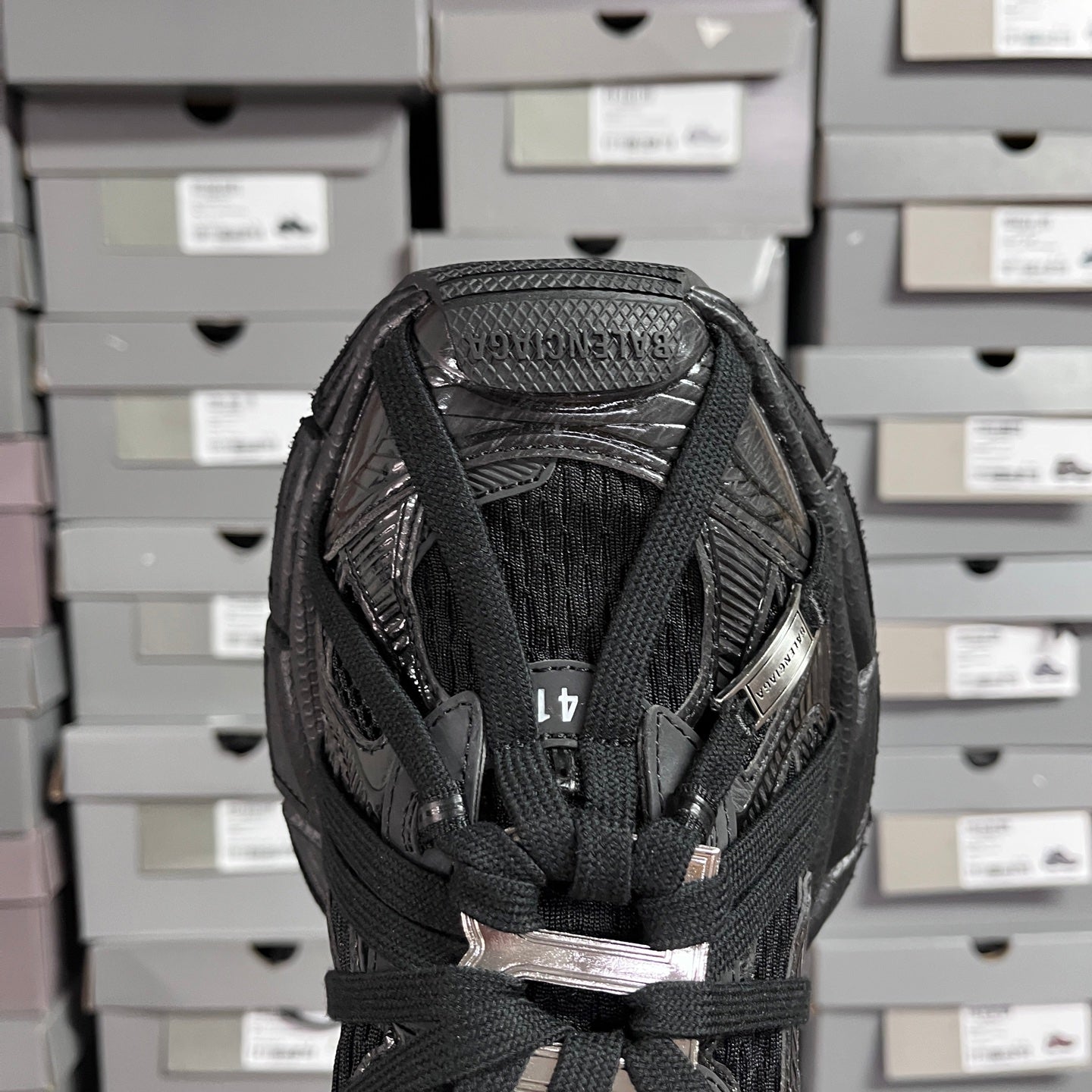 Black Balenciaga unisex sneaker toe and tongue view with woven mesh and laces