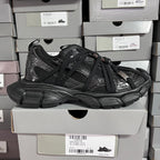 Black Balenciaga unisex sneakers, lace-up design with layered panels and padded sole