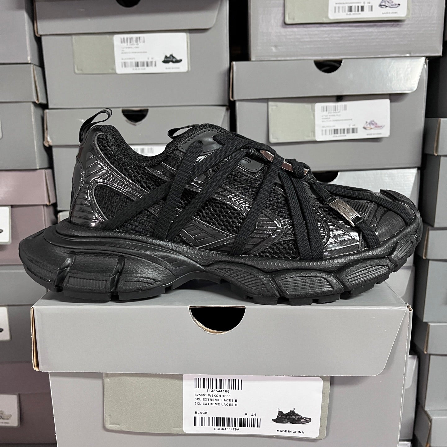 Black Balenciaga unisex sneakers, lace-up design with layered panels and padded sole