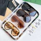 Multiple sunglasses on tray with mixed frames and tinted lenses