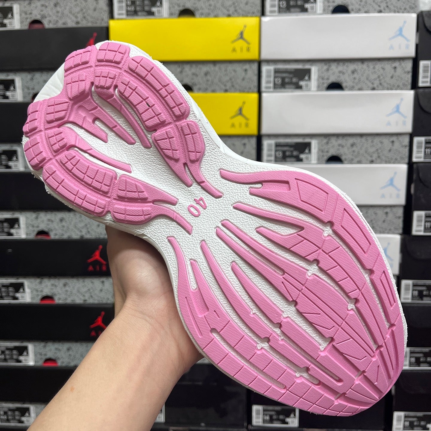 Pink and white Balenciaga sneaker outsole with textured tread pattern