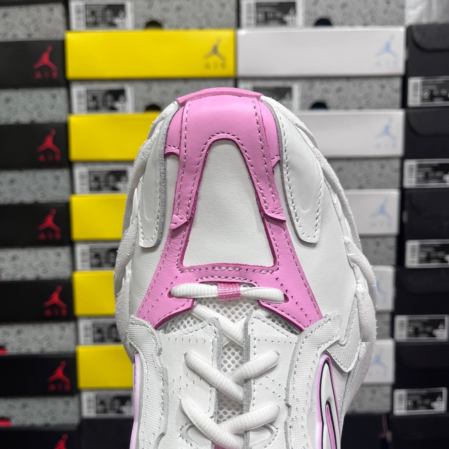 White and pink Balenciaga sneaker rear view with pink padded collar and stitched panel