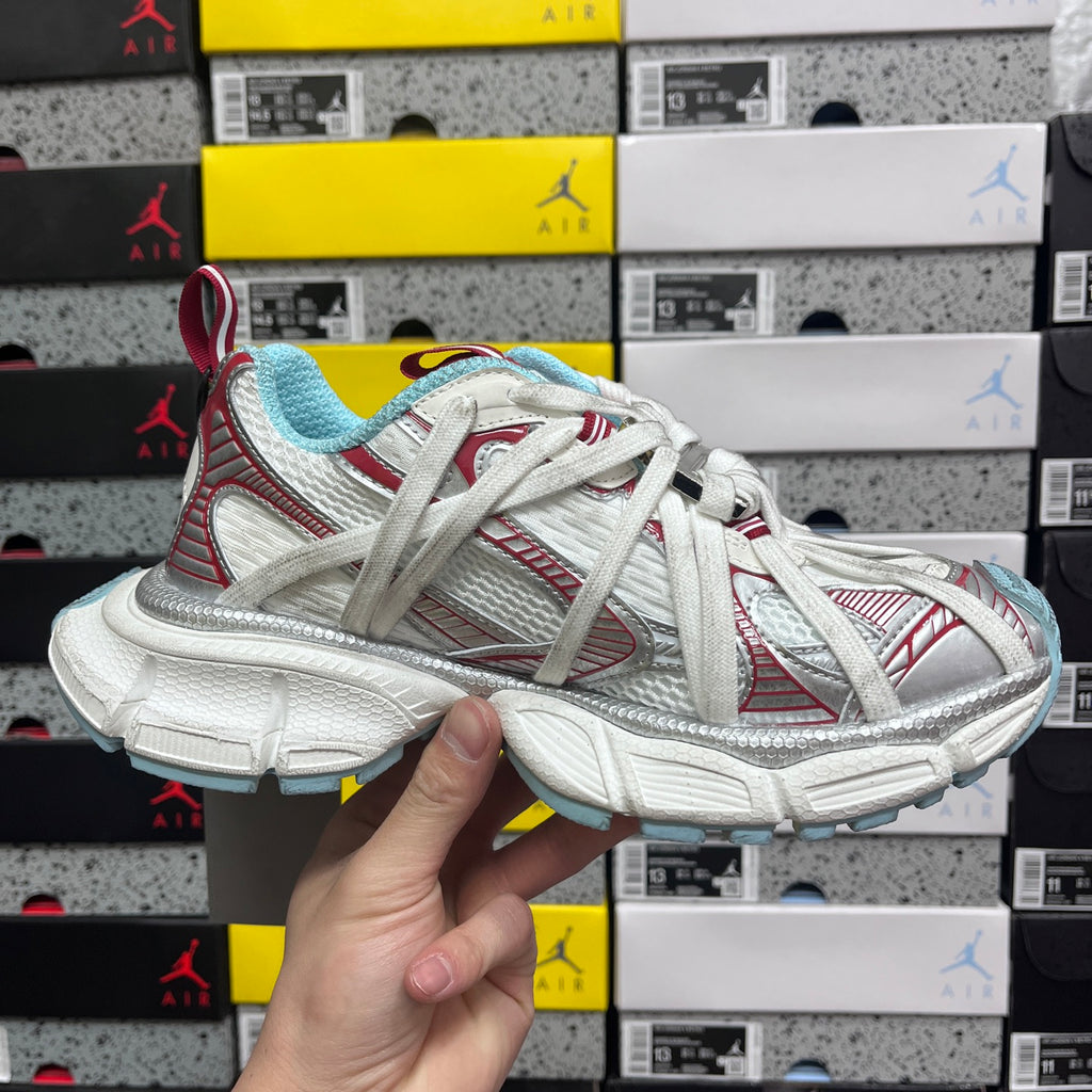 Balenciaga unisex sneaker in white with red accents and light blue outsole