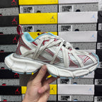Balenciaga unisex sneaker in white with red accents and light blue outsole