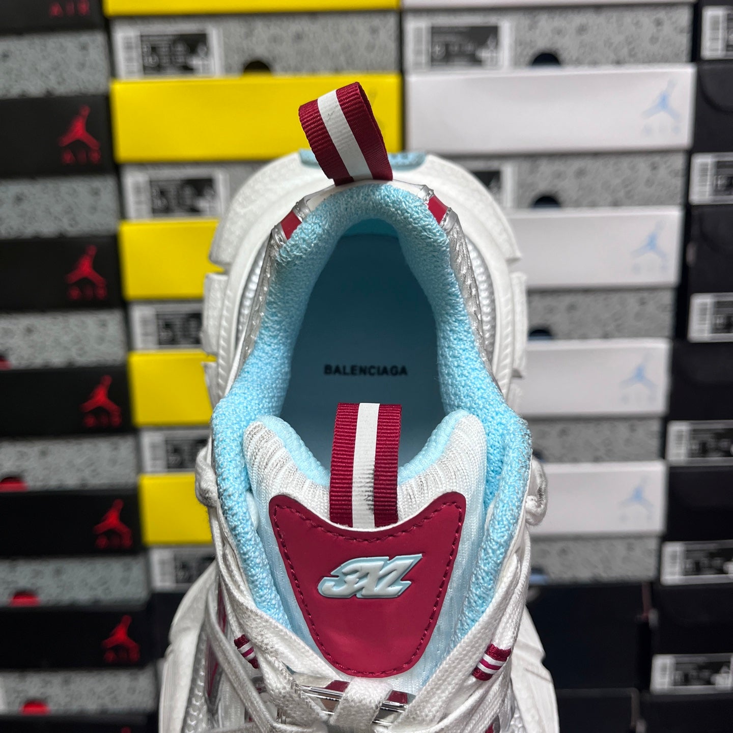 Balenciaga sneaker interior view with light blue collar and red insole patch
