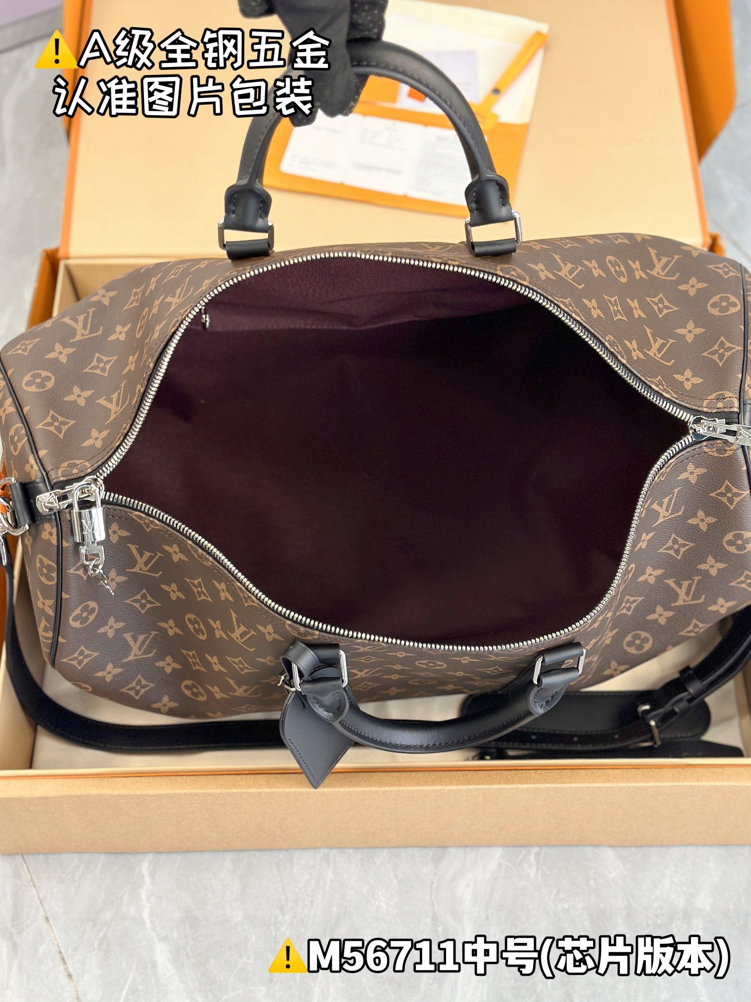 Men's satchel with monogram canvas and zipper opening; burgundy lining visible inside.