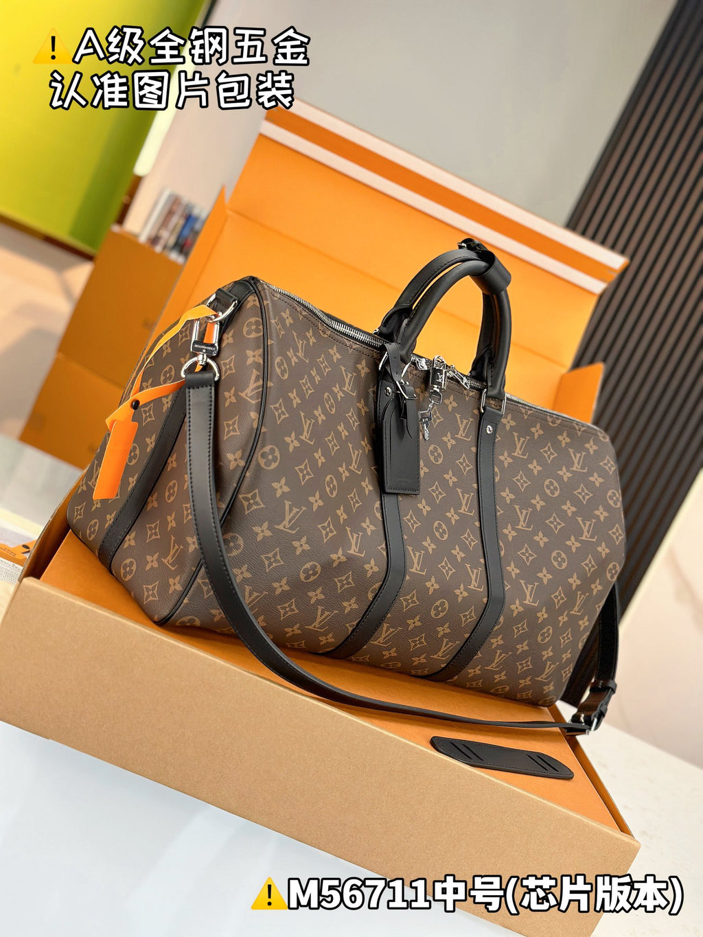 Men's satchel with monogram canvas, two top handles, front strap, and hanging accessory tag.