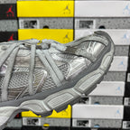 Unisex light gray sneakers, side profile with thick sole and woven upper panels