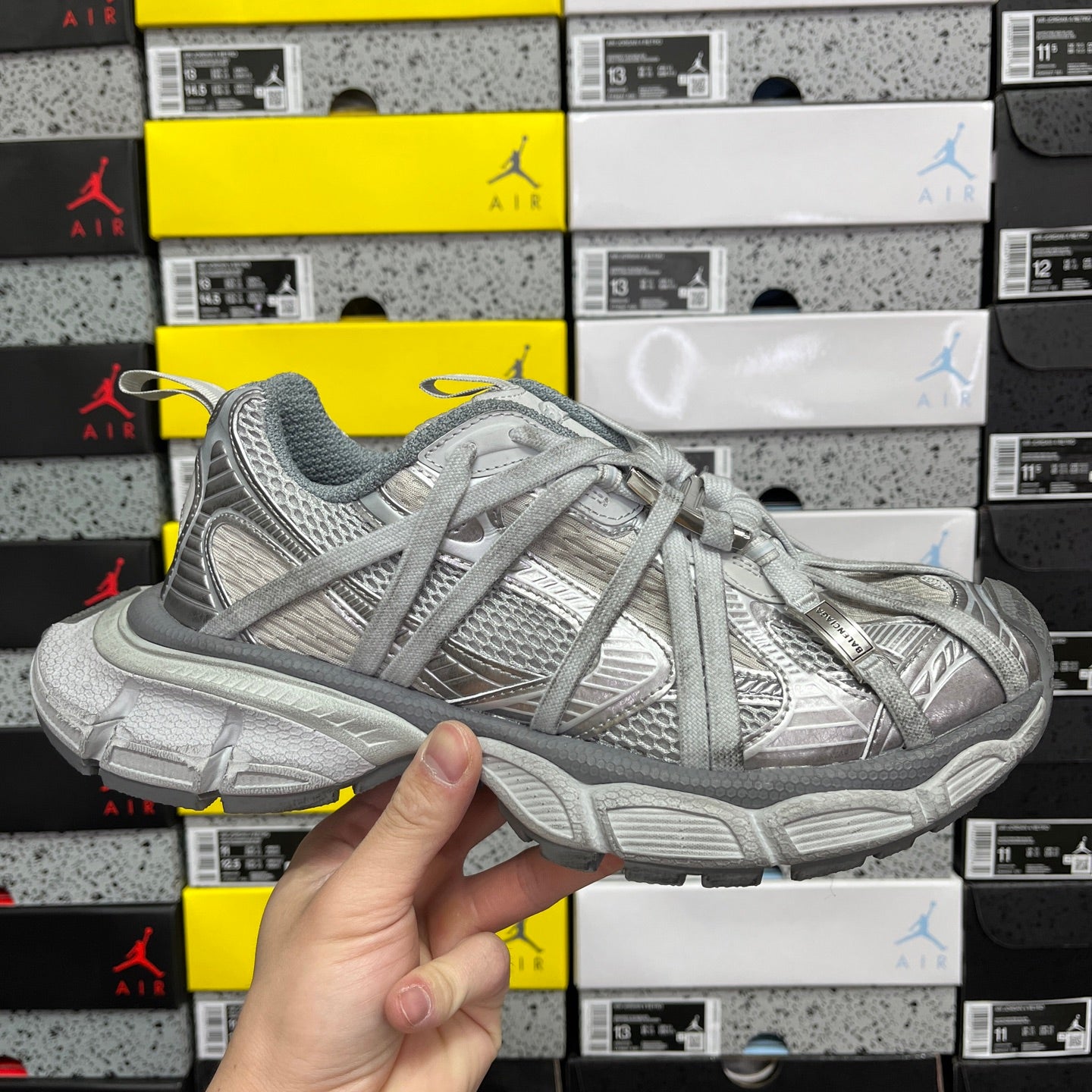 Unisex sneakers in light gray with textured uppers and lace-up front, chunky sole